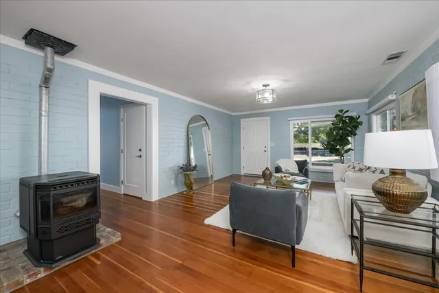 a living room with furniture and a piano