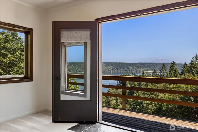 a view of a glass door and a balcony