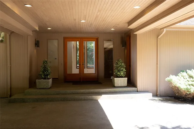 a view of a entryway door of the room