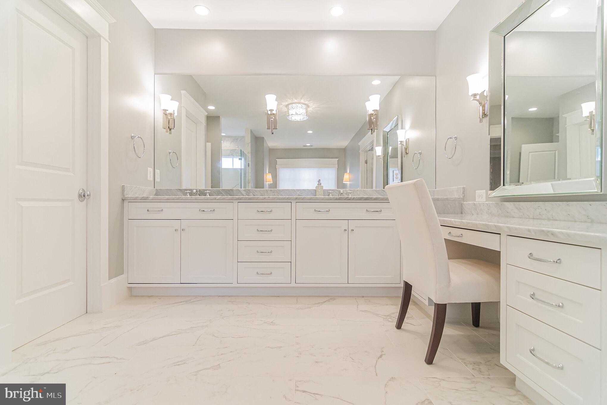 6801 Danforth Street McLean, VA 22101 - Photo 17 of 29 a bathroom with a sink vanity and a mirror
