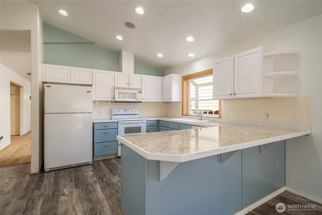 a kitchen with a sink a refrigerator and a sink