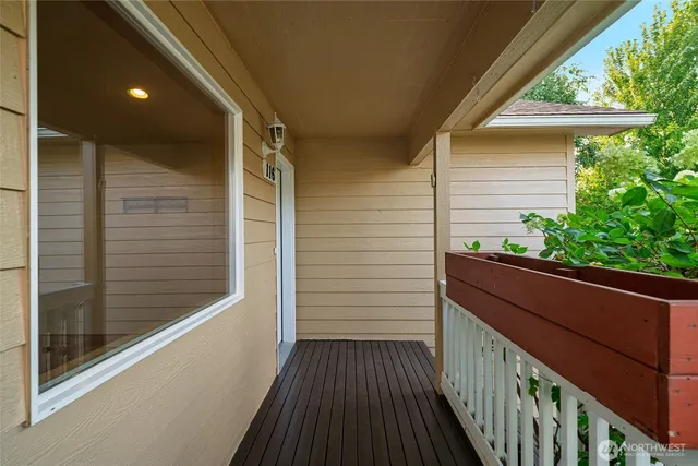 a view of a balcony with wooden floor