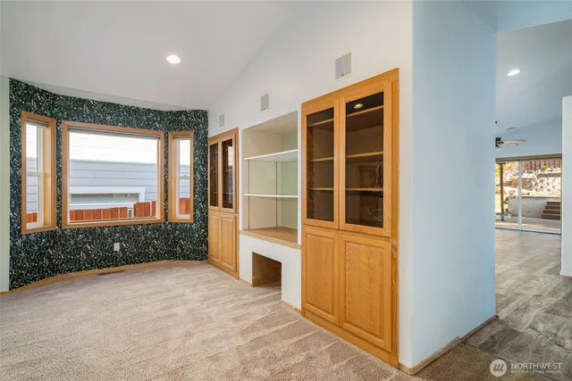 a view of an empty room with a window