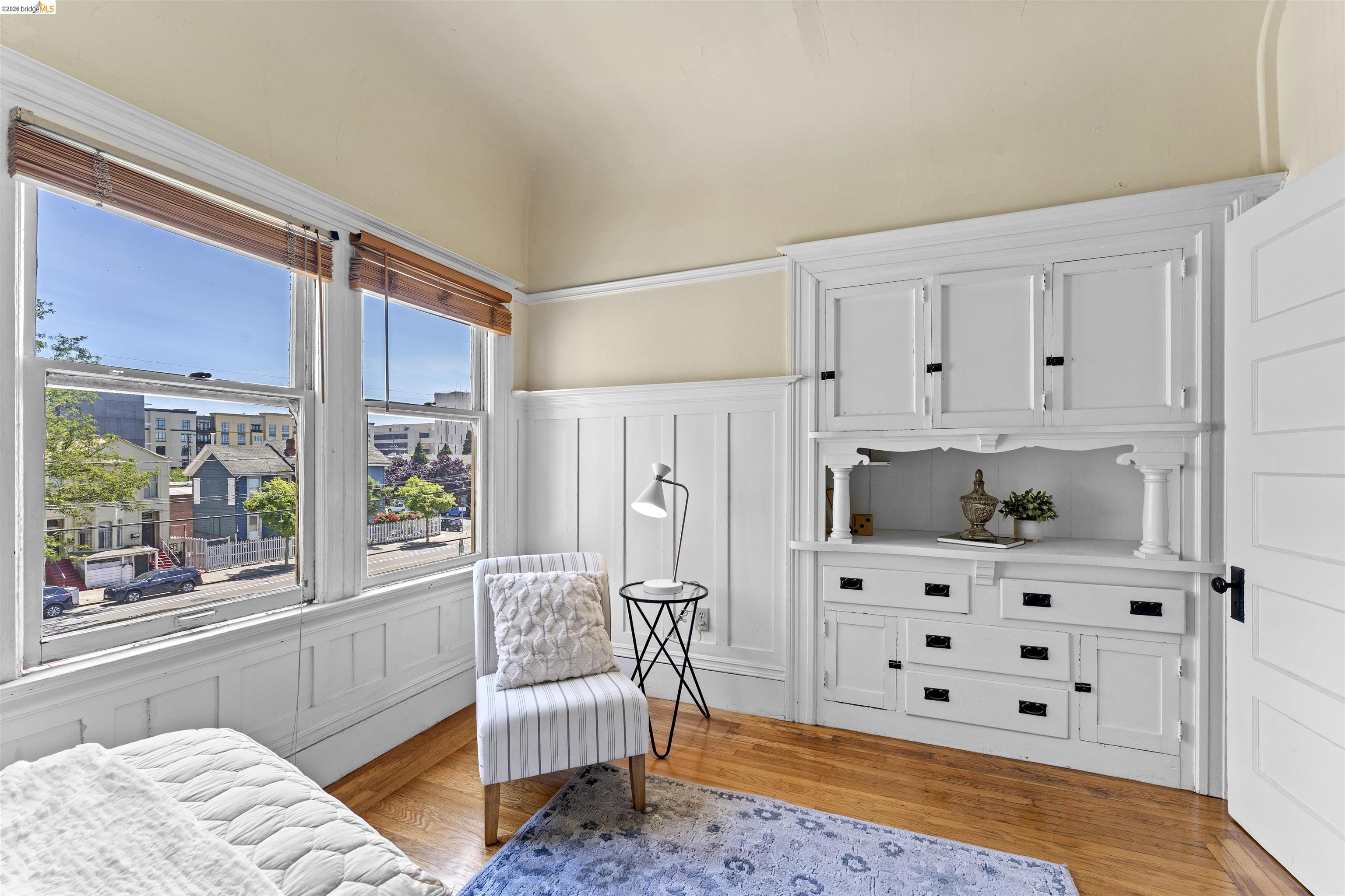 667 10th Street Oakland, CA 94607 - Photo 7 of 15 a bedroom with furniture and a window