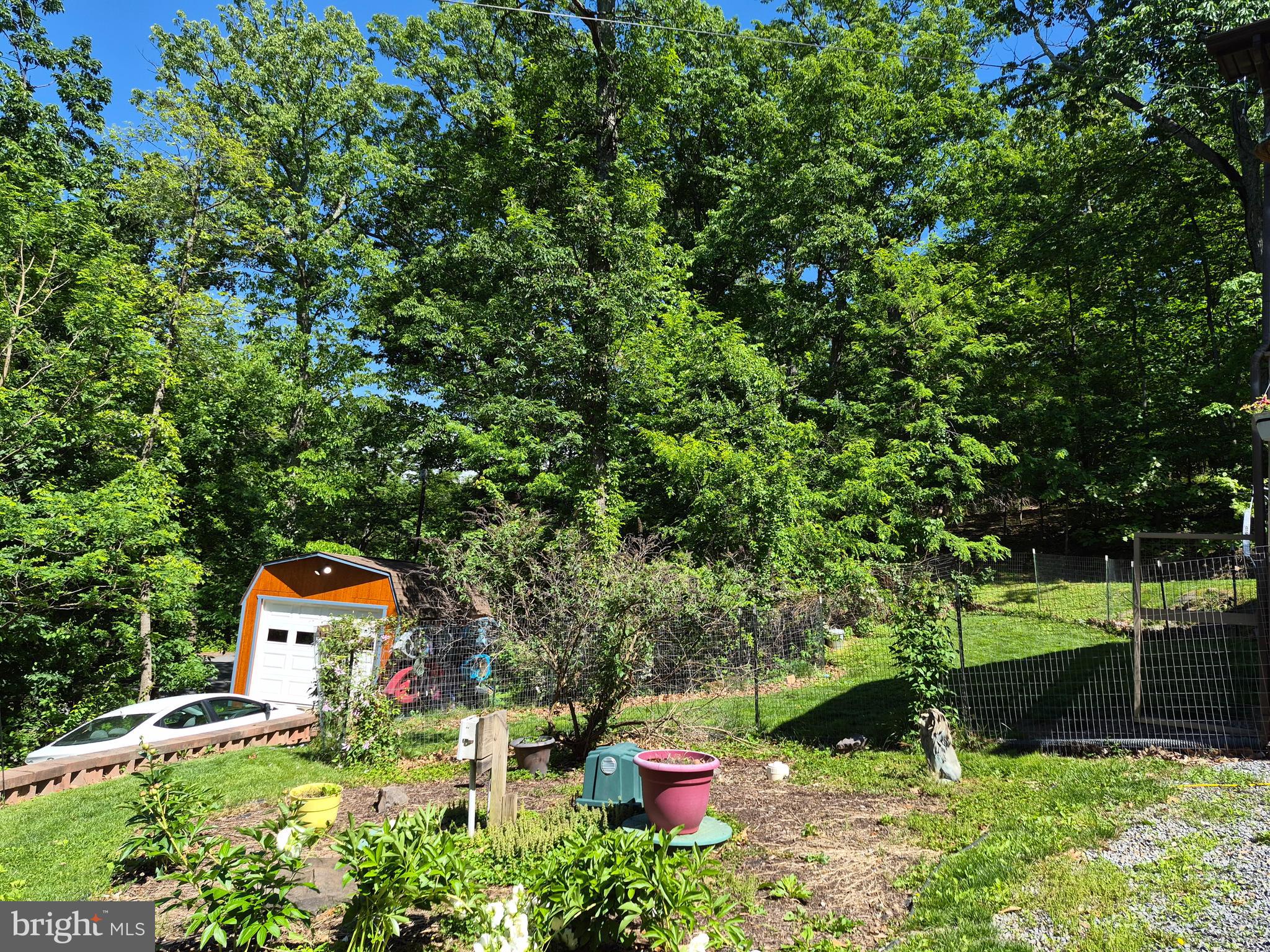 1440 Drummer Hill Road Front Royal, VA 22630 - Photo 14 of 42 a backyard of a house with a yard and outdoor seating