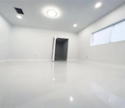 an empty room with windows