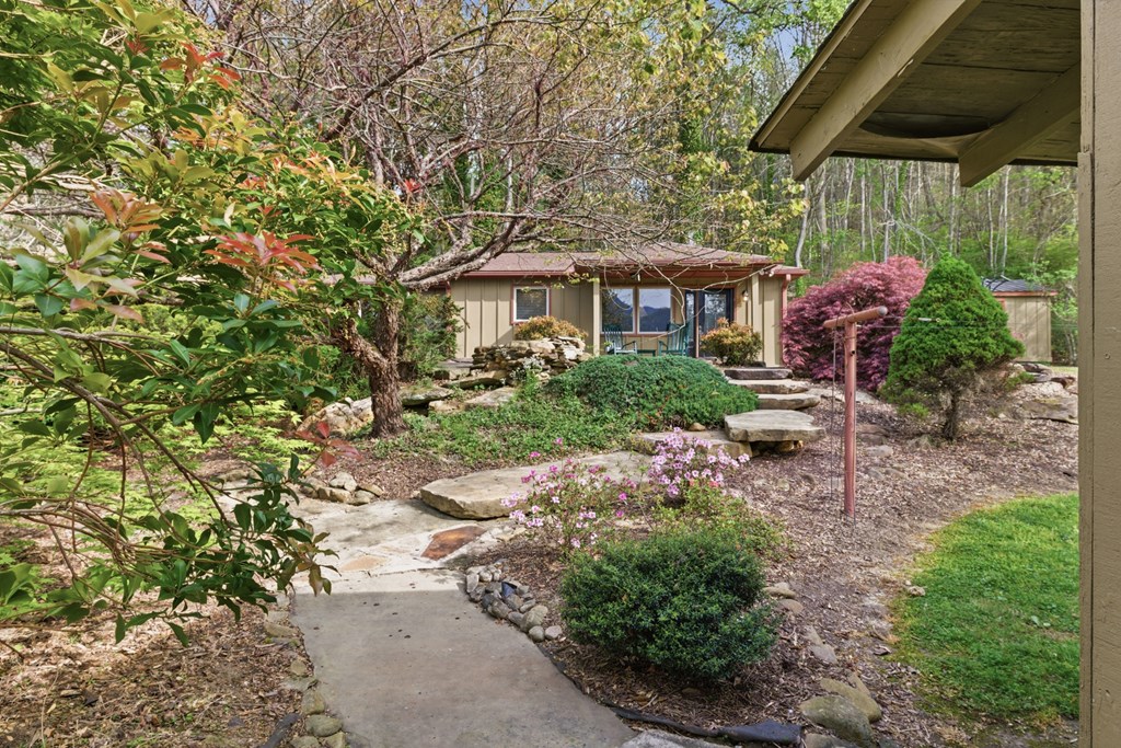 6203 Airport Road Andrews, NC 28901 - Photo 34 of 50 a view of a patio with table and chairs under an umbrella