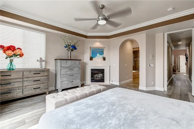 a view of a livingroom with a fireplace a chandelier and stairs