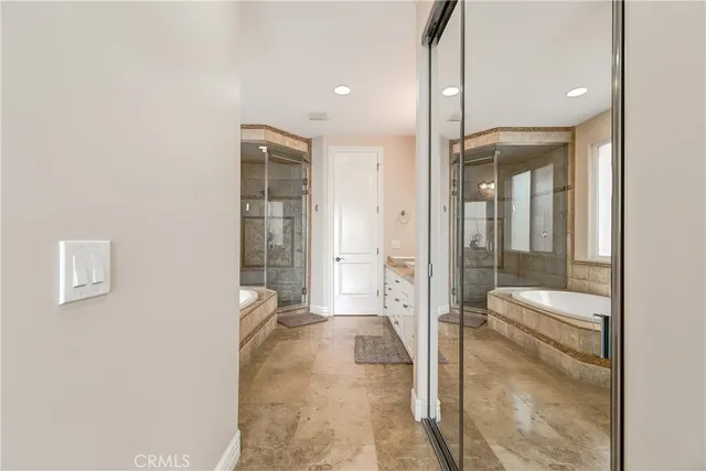 a bathroom with a glass shower door