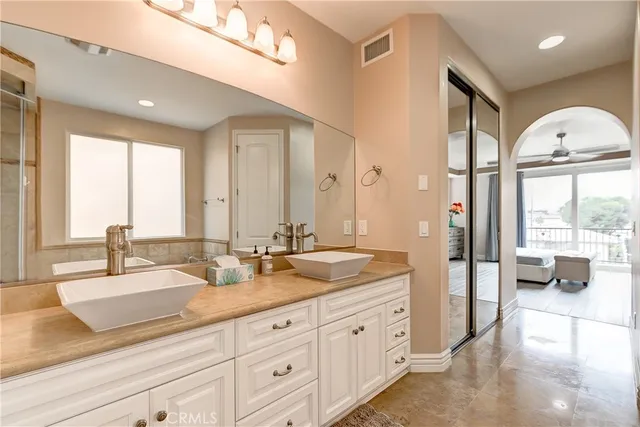 a spacious bathroom with sinks mirror and double