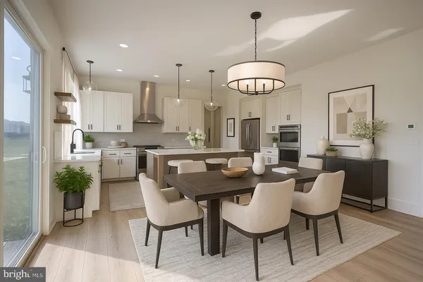 a view of a dining room with furniture wooden floor and chandelier