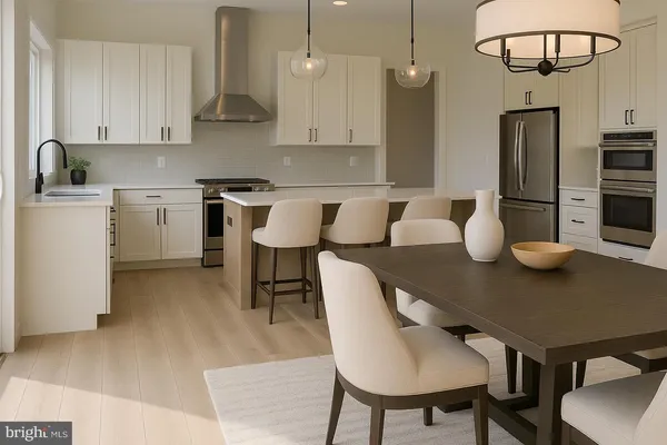 a kitchen with stainless steel appliances granite countertop a sink a stove a table and chairs