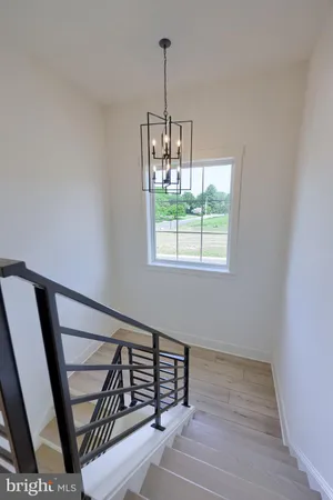 a view of wooden floor and windows in a room