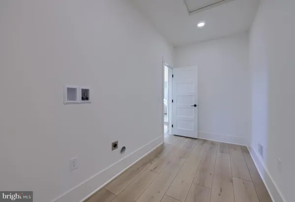 a view of room with wooden floor