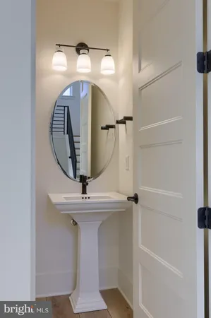 a bathroom with a mirror and a shower