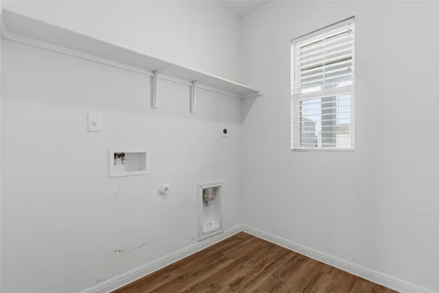 a view of an empty room and a window