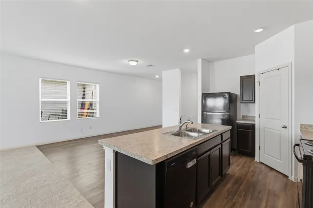 an aerial view of a house with outdoor space and lake view