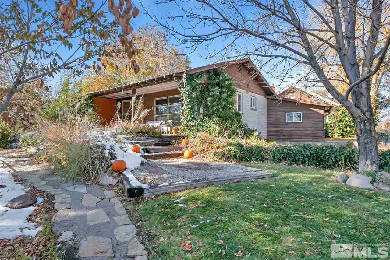 1135 The Strand Reno, NV 89503 - Photo 1 of 33 a view of a backyard with a large tree and a yard