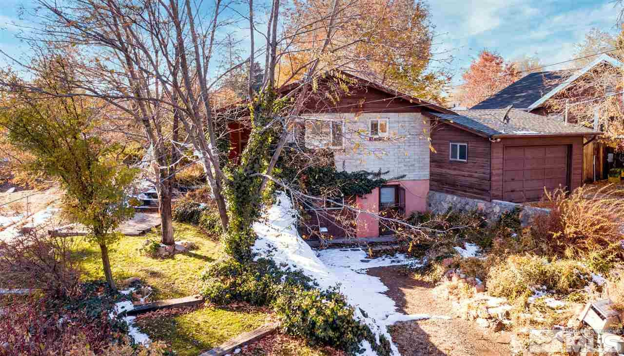 1135 The Strand Reno, NV 89503 - Photo 2 of 33 a view of a house with a yard covered with snow