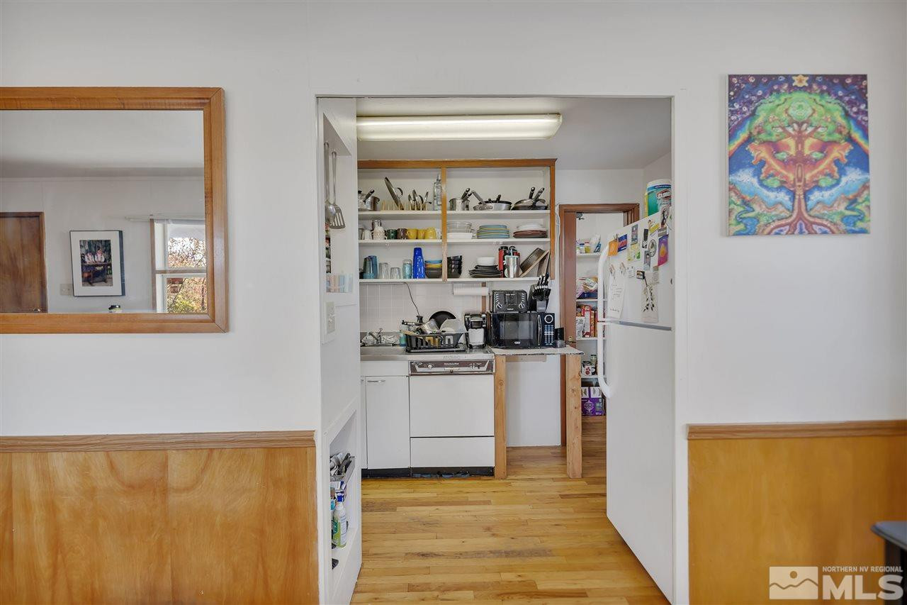1135 The Strand Reno, NV 89503 - Photo 24 of 33 a kitchen with stainless steel appliances a refrigerator and a stove
