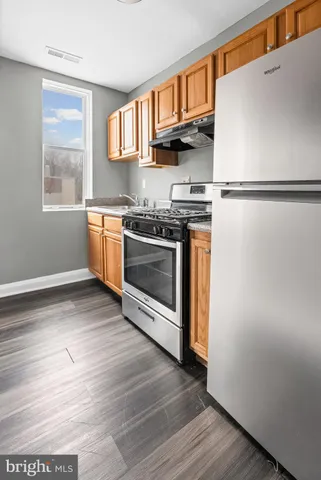 a bathroom with a toilet a sink and bathtub