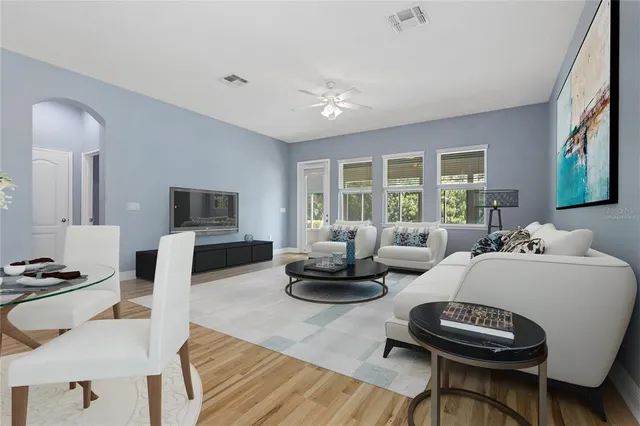 a living room with furniture and a large window