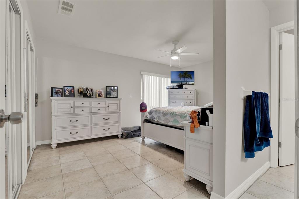 212 Perth Court Winter Springs, FL 32708 - Photo 15 of 57 a view of a bedroom with furniture and cabinet