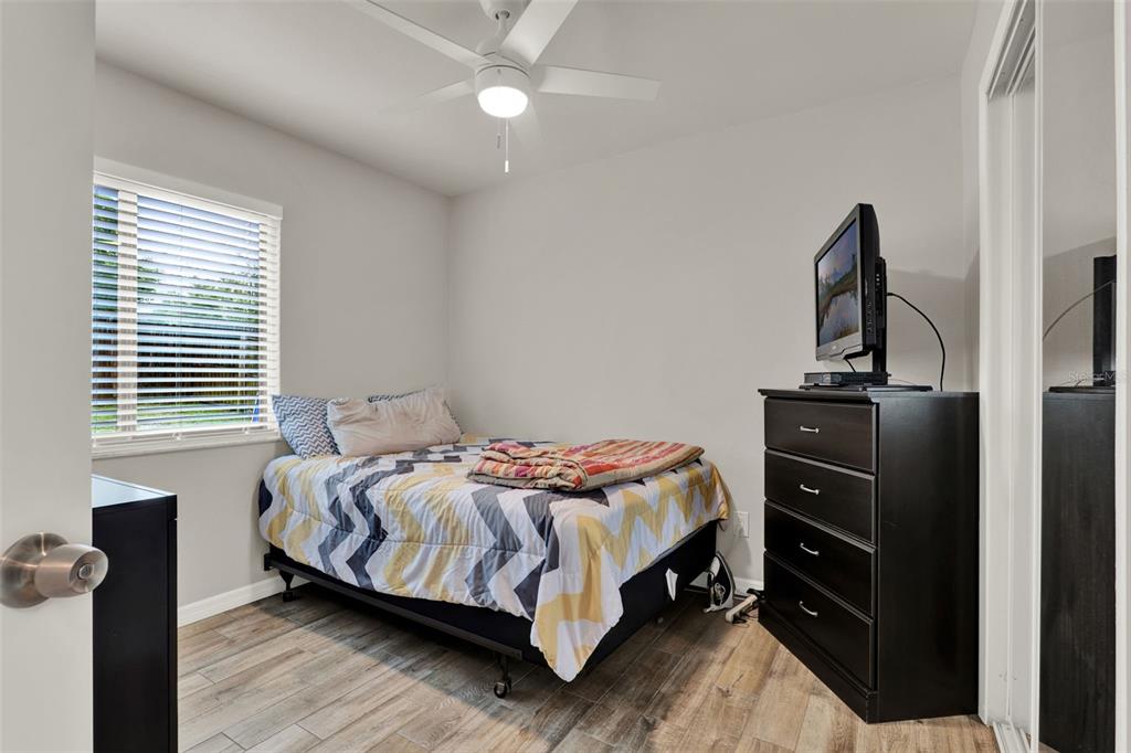 212 Perth Court Winter Springs, FL 32708 - Photo 18 of 57 a bedroom with a bed and dresser