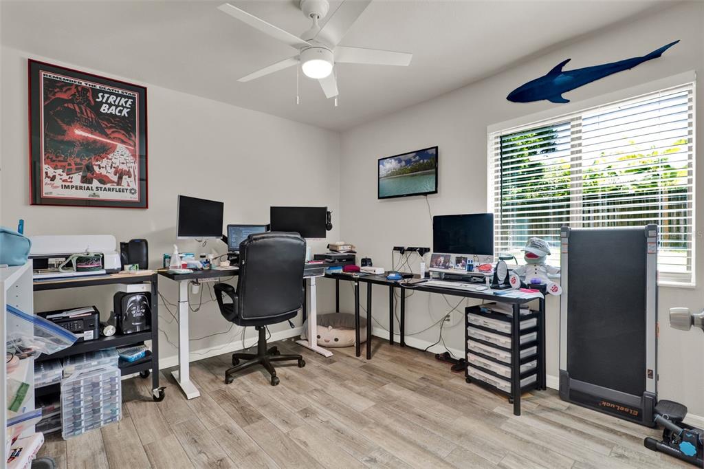 212 Perth Court Winter Springs, FL 32708 - Photo 21 of 57 a view of a workspace with furniture and a window