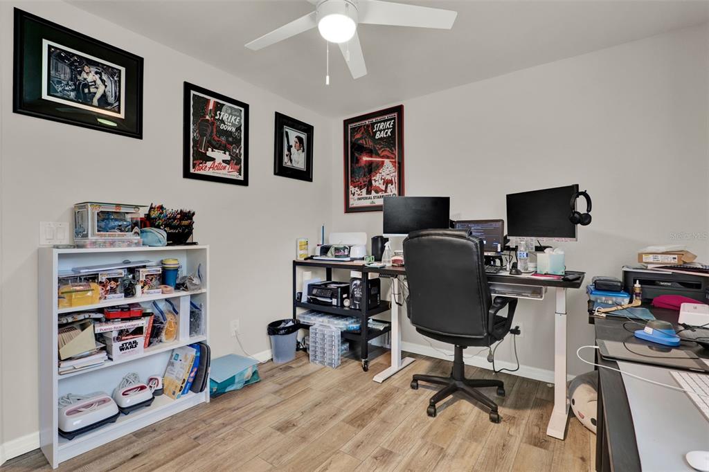 212 Perth Court Winter Springs, FL 32708 - Photo 22 of 57 a view of a workspace with furniture and a window