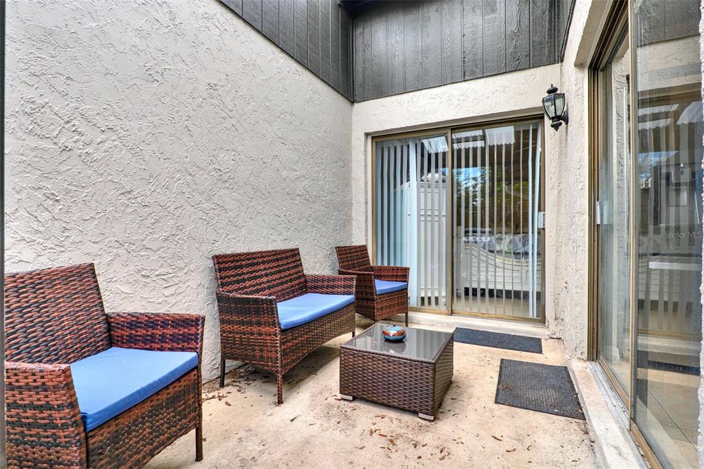 212 Perth Court Winter Springs, FL 32708 - Photo 24 of 57 a outdoor living space with furniture and a rug