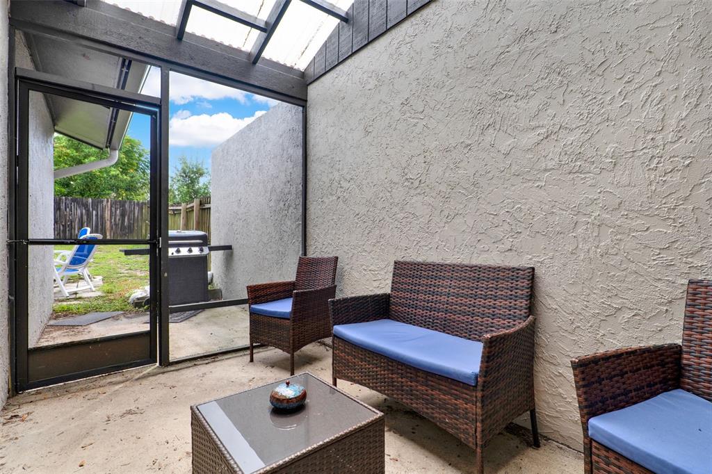 212 Perth Court Winter Springs, FL 32708 - Photo 25 of 57 a outdoor living space with furniture and a potted plant