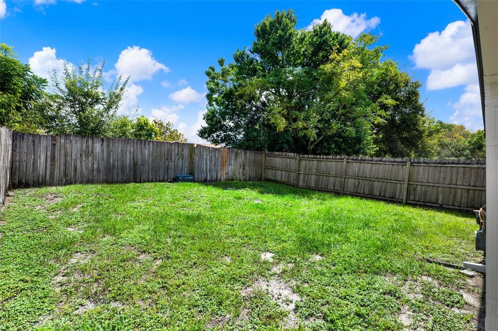 212 Perth Court Winter Springs, FL 32708 - Photo 30 of 57 a view of a backyard with a garden