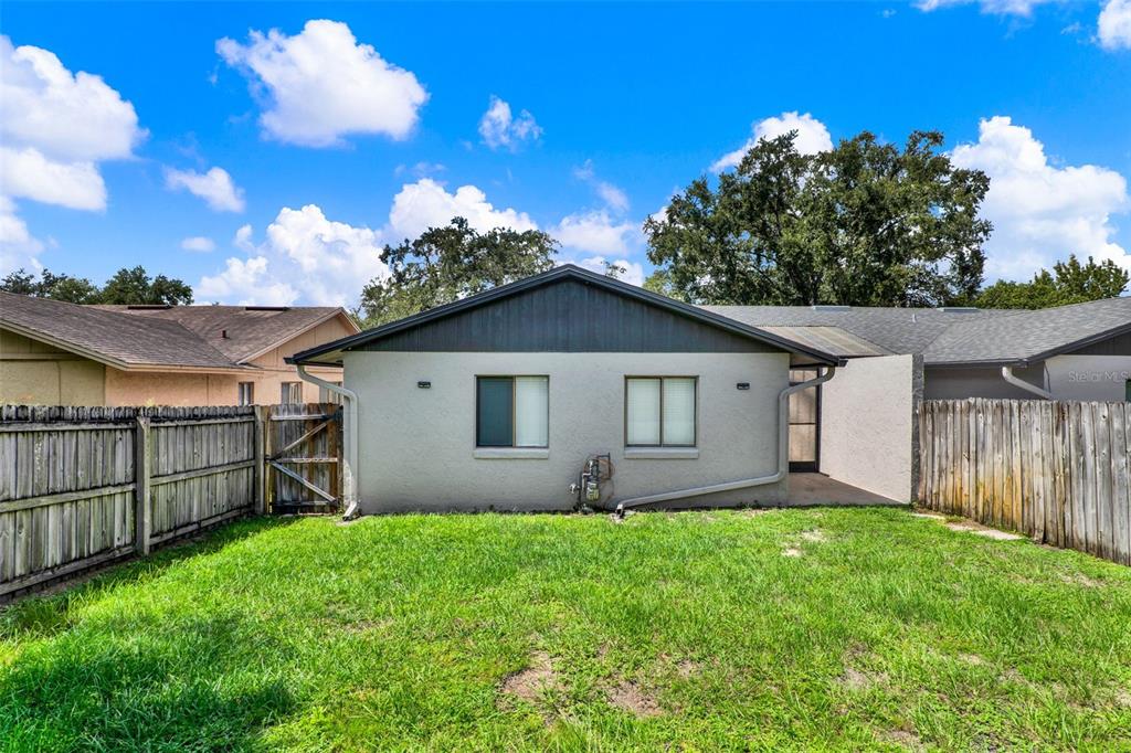 212 Perth Court Winter Springs, FL 32708 - Photo 32 of 57 a view of yard with small yard and wooden fence
