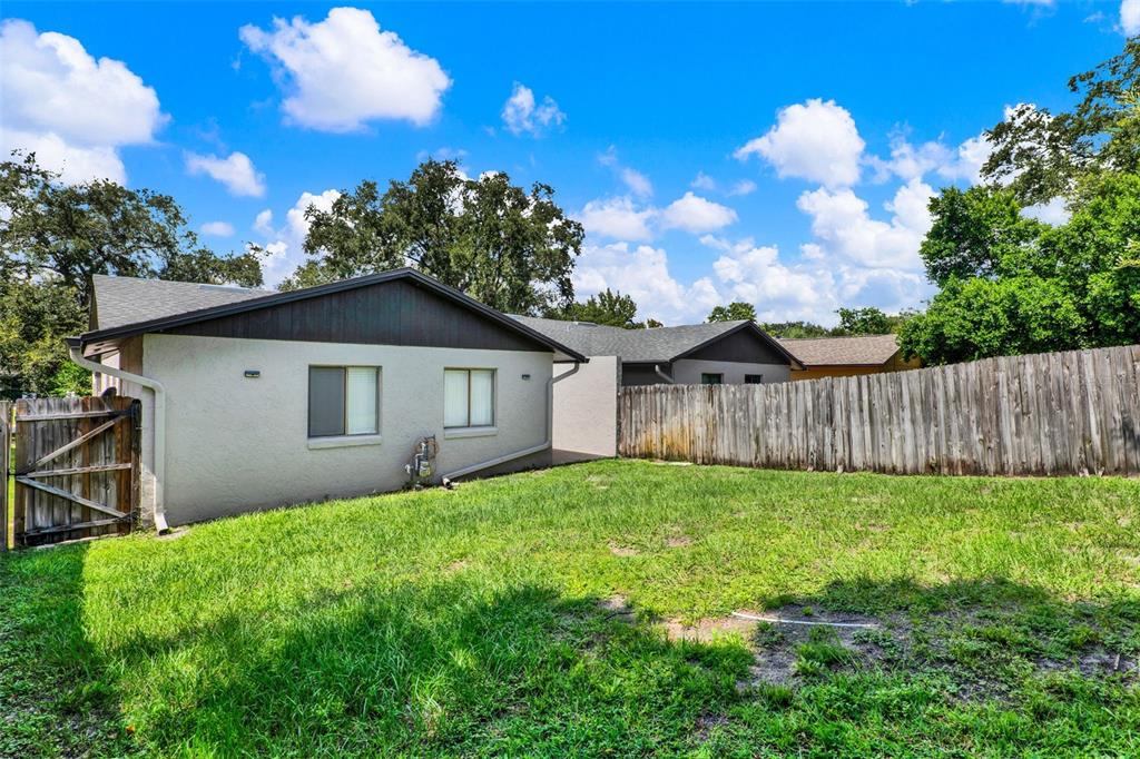 212 Perth Court Winter Springs, FL 32708 - Photo 33 of 57 a house with green field in front of it