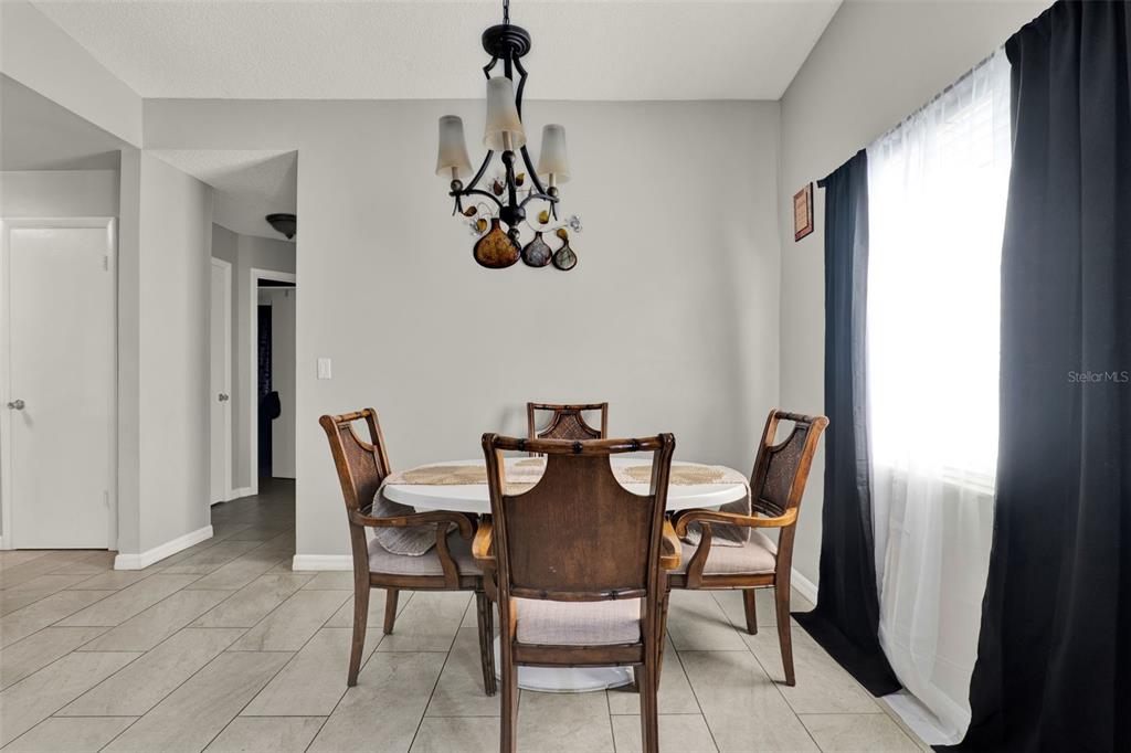 212 Perth Court Winter Springs, FL 32708 - Photo 39 of 57 a view of a dining room with furniture and window