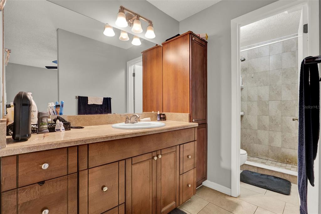 212 Perth Court Winter Springs, FL 32708 - Photo 47 of 57 a bathroom with a double vanity sink and a mirror