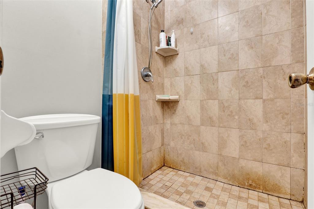 212 Perth Court Winter Springs, FL 32708 - Photo 48 of 57 a white toilet sitting next to a bathroom sink