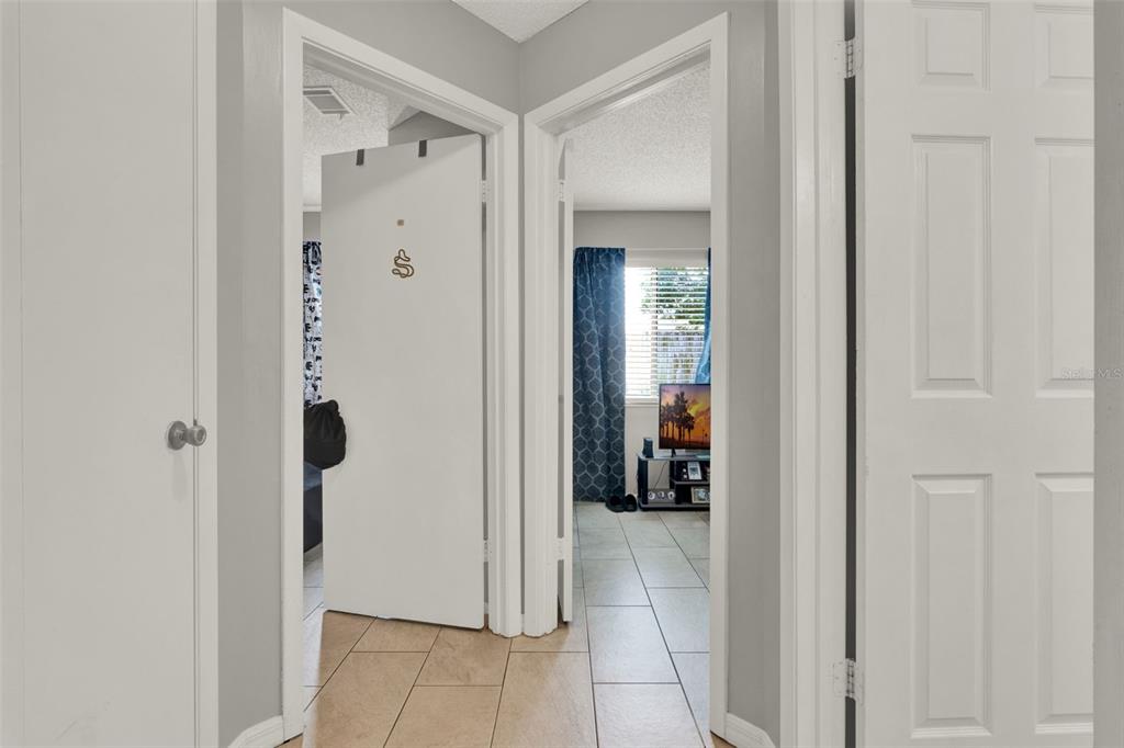 212 Perth Court Winter Springs, FL 32708 - Photo 54 of 57 a view of a hallway with a livingroom and a bathroom