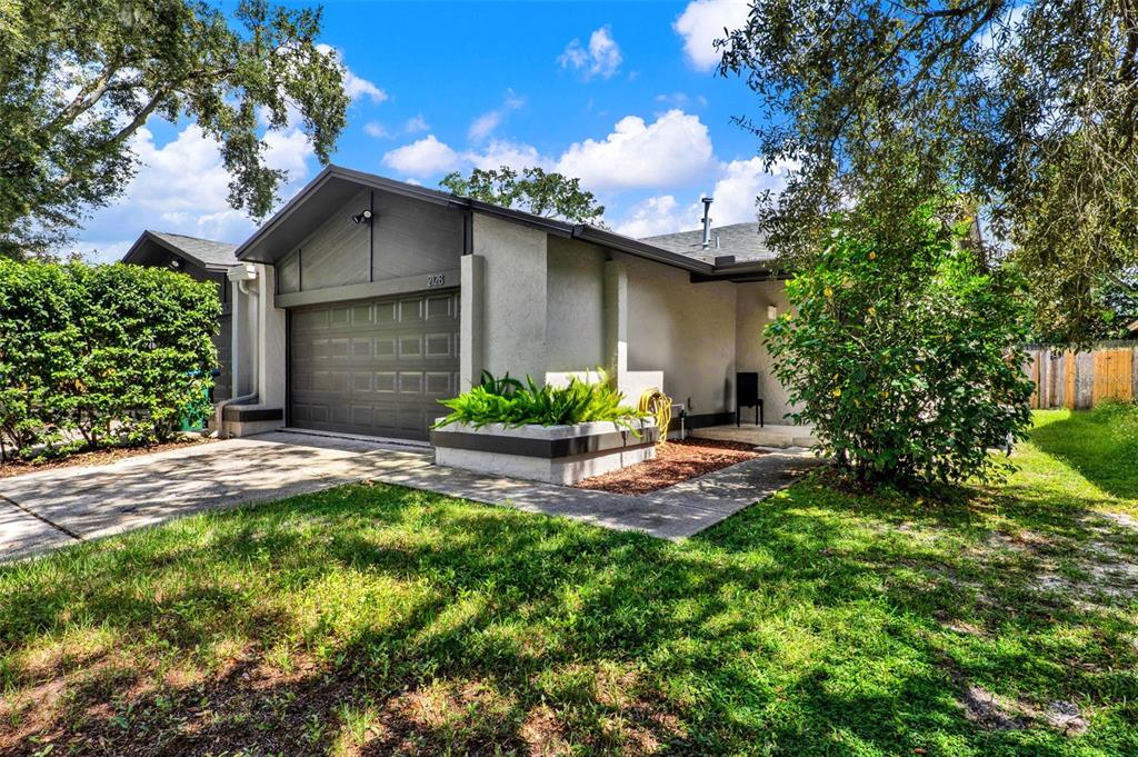 212 Perth Court Winter Springs, FL 32708 - Photo 57 of 57 a front view of a house with a yard and garage