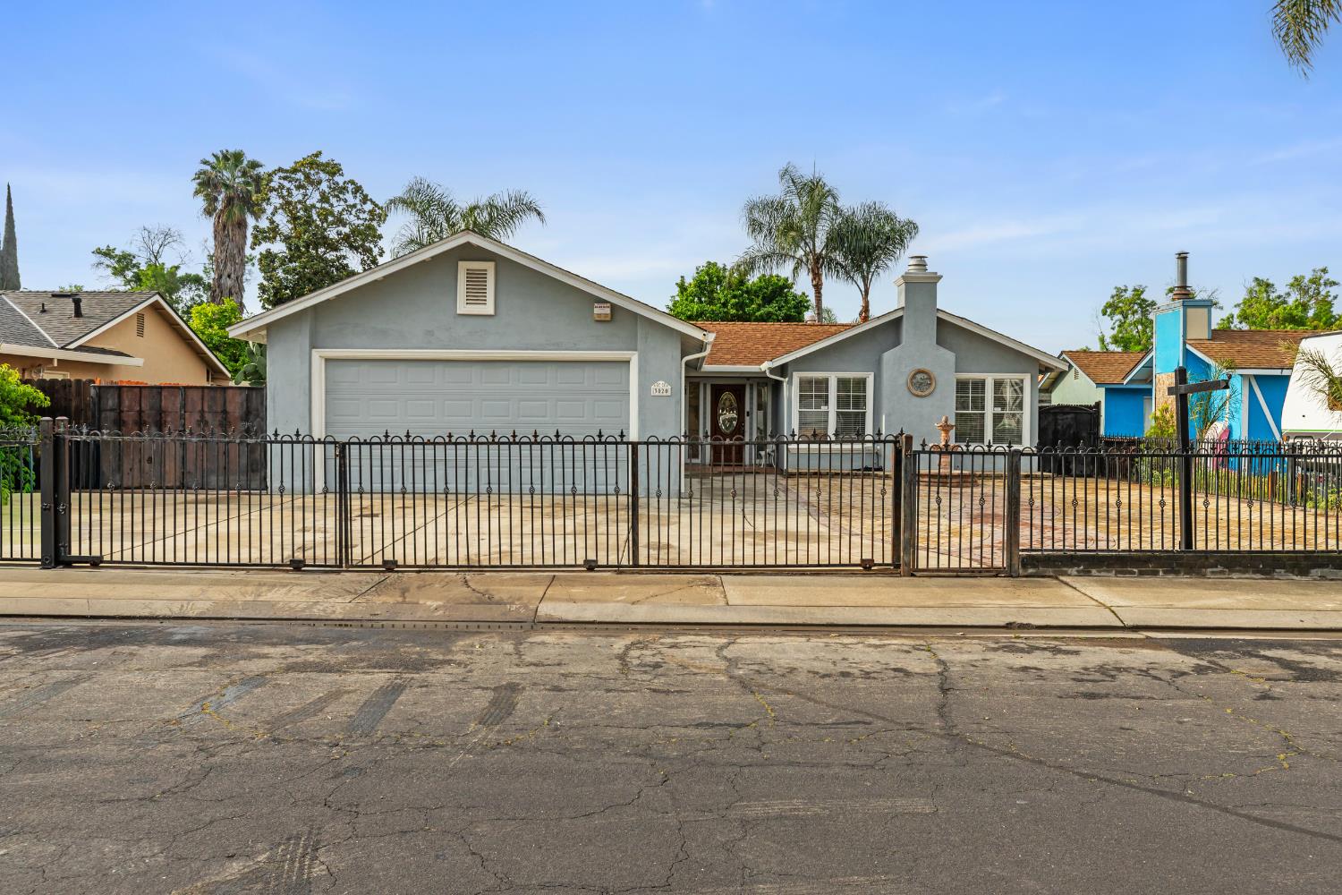 a view of a house with a small yard and plants