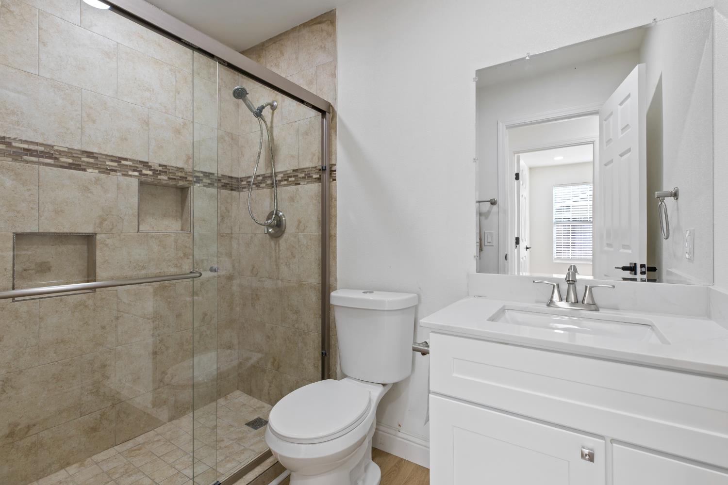 3020 Trudi Way Modesto, CA 95354 - Photo 15 of 24 a bathroom with a sink a toilet and shower