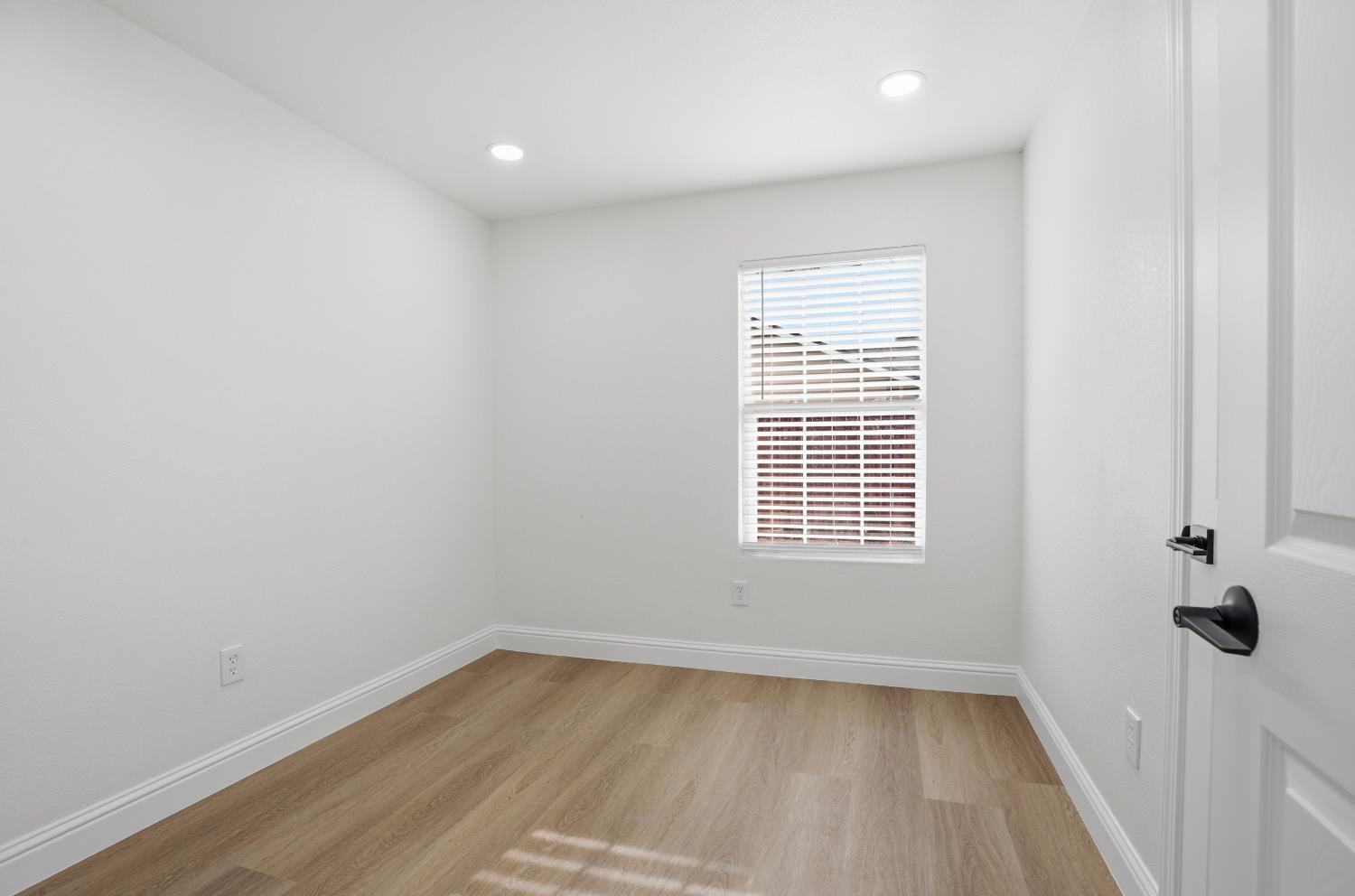 3020 Trudi Way Modesto, CA 95354 - Photo 17 of 24 wooden floor in an empty room with a window