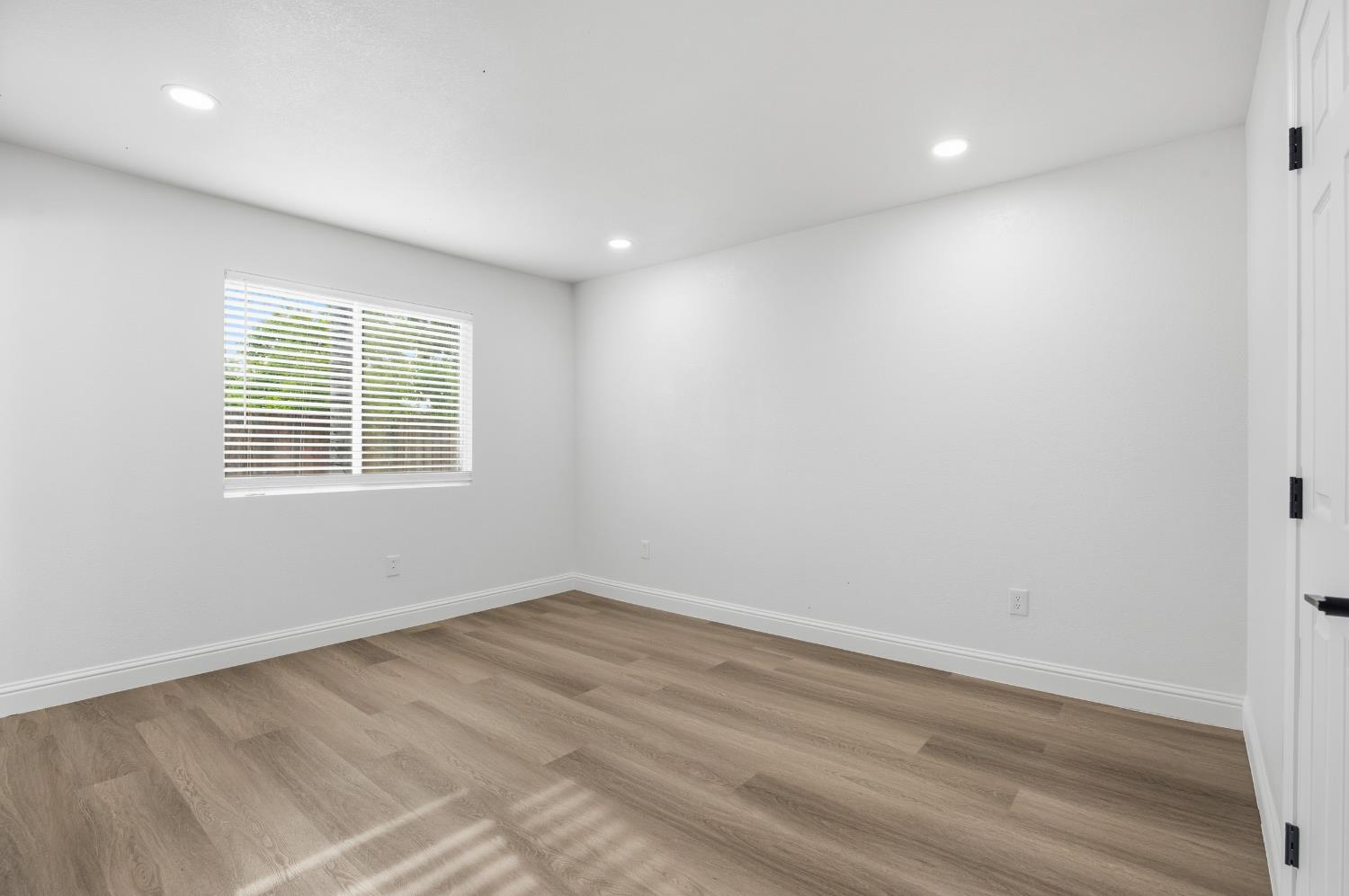 3020 Trudi Way Modesto, CA 95354 - Photo 20 of 24 wooden floor in an empty room with a window