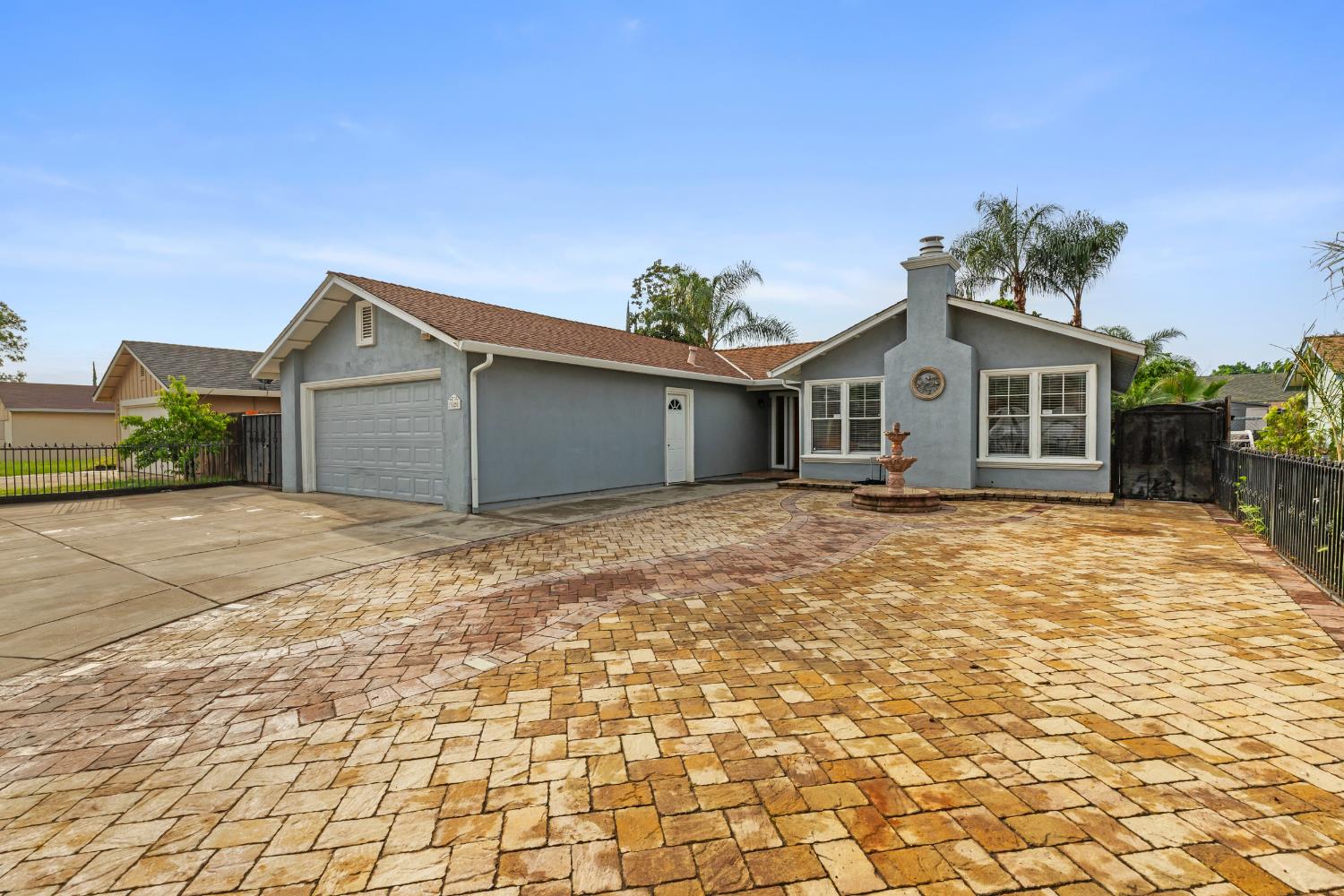 3020 Trudi Way Modesto, CA 95354 - Photo 3 of 24 a front view of a house with a yard