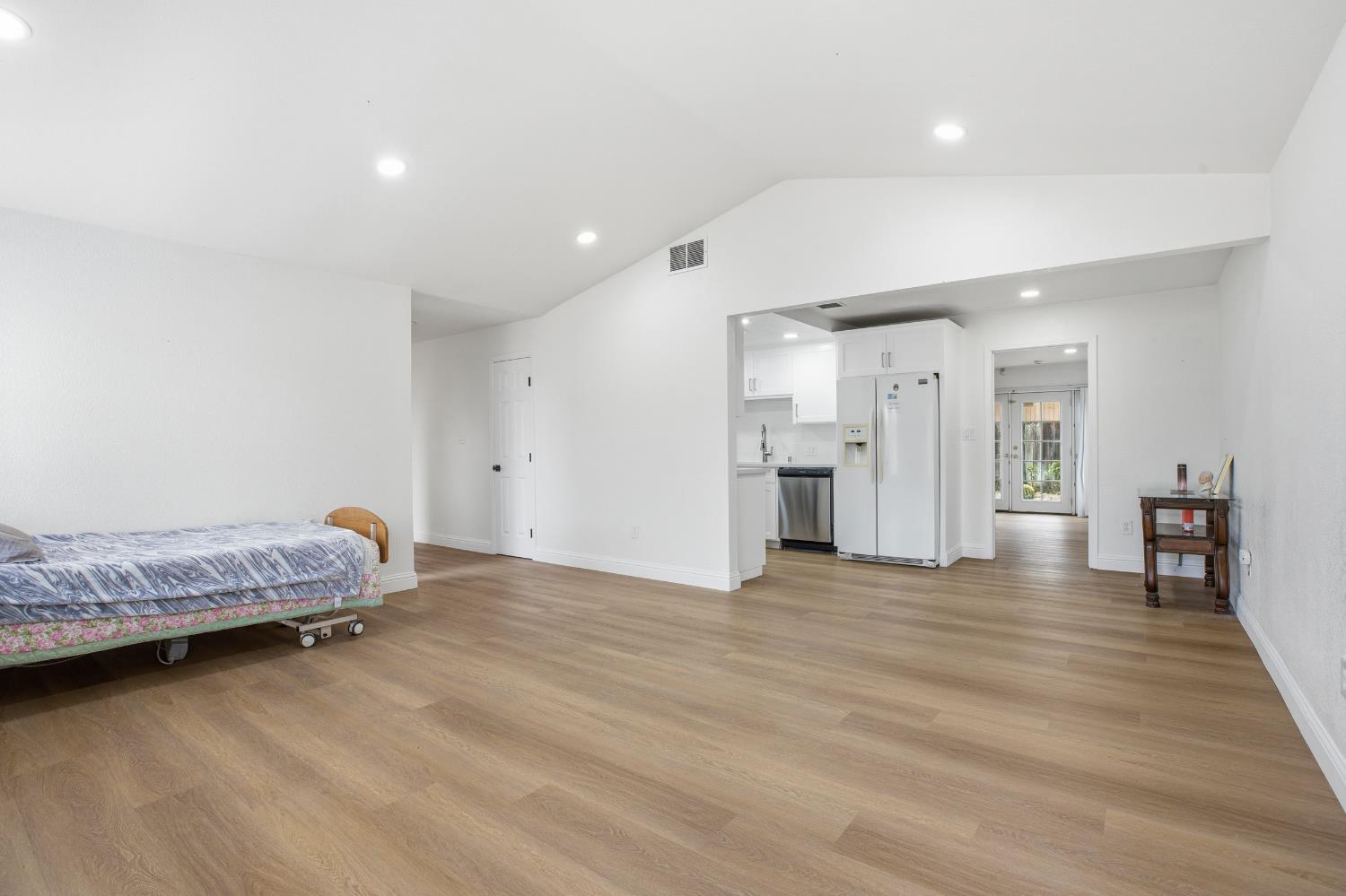 3020 Trudi Way Modesto, CA 95354 - Photo 9 of 24 a spacious bedroom with a bed and a chandelier