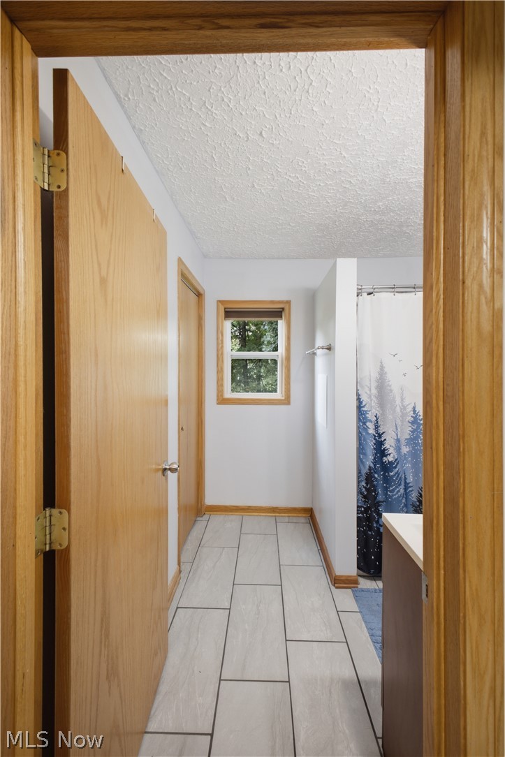 1057 Center Road Clinton, OH 44216 - Photo 14 of 24 Light-toned rectangular tile flooring