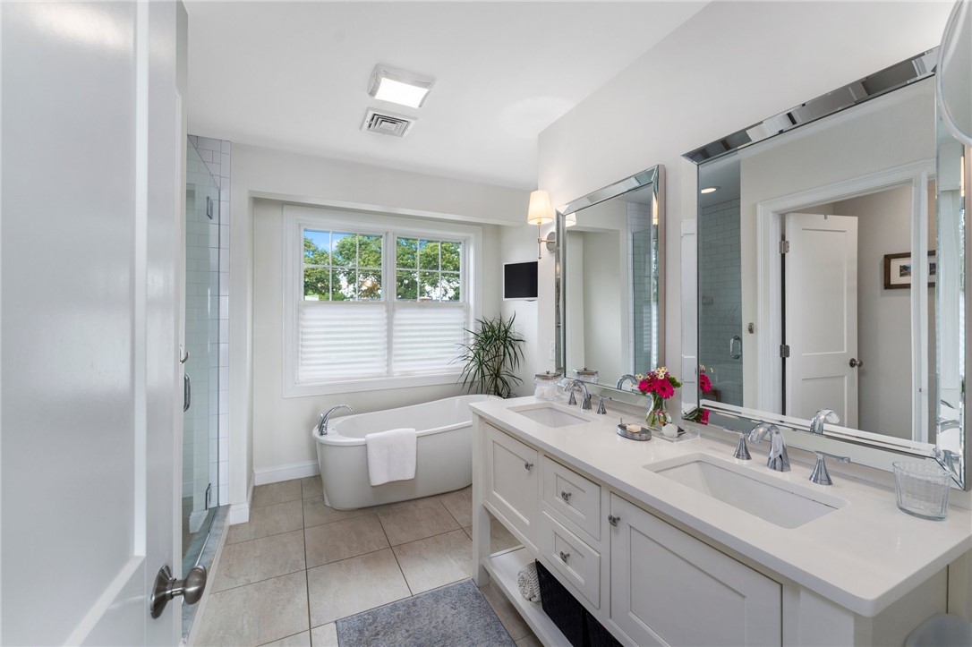 297 Gorton Lake Boulevard Warwick, RI 02886 - Photo 20 of 38 Enjoy the soaking tub in the main suite bathroom