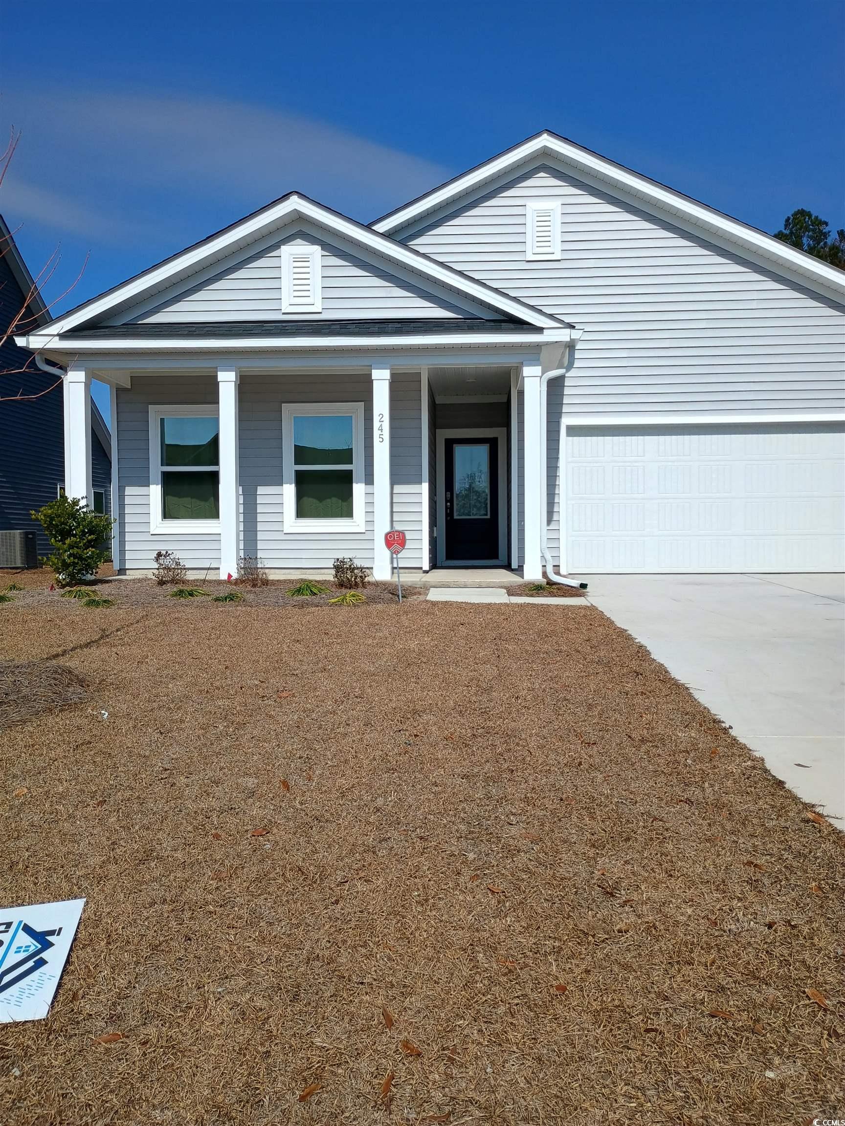3095 Palma Way Myrtle Beach, SC 29579 - Photo 3 of 8 View of front of house featuring a garage, covered