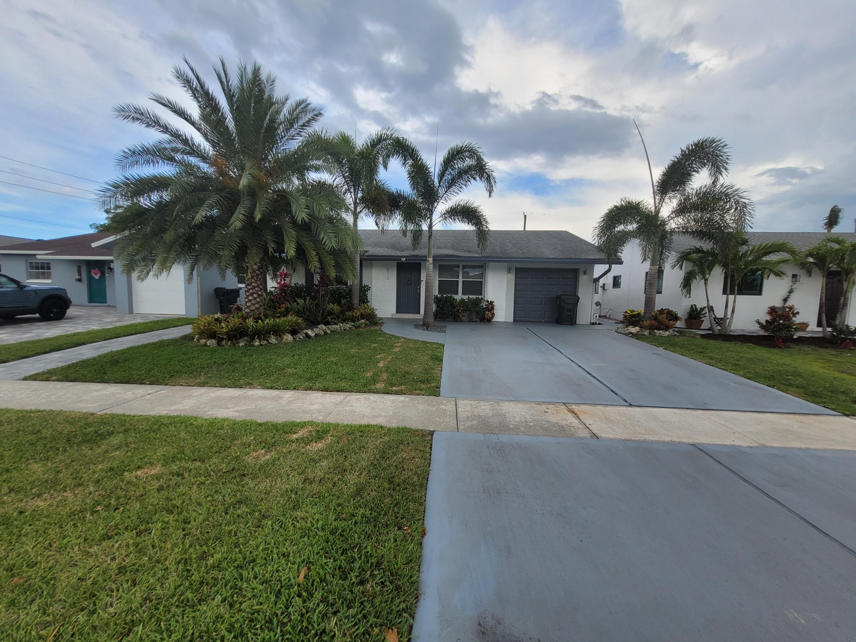 516 Northwest 54th Street Boca Raton, FL 33487 - Photo 2 of 22 20220418_162844